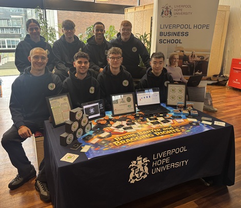 Young Enterprise winners sat at a stall